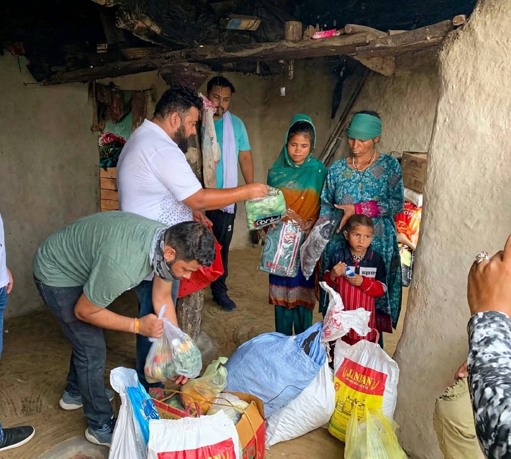 Micky Humanity volunteers delivering educare and household supplies to a family